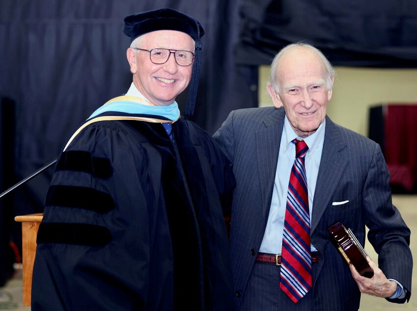Longtime university supporter William W. &quot;Bill&quot; Shaw, right, Birch Tree, receives the prestigious Granvil Vaughan Founder&rsquo;s Award during Saturday&rsquo;s Missouri State University-West Plains commencement ceremonies at the West Plains Civic Center.&nbsp;Presenting the award is MSU-WP Chancellor Dennis Lancaster.