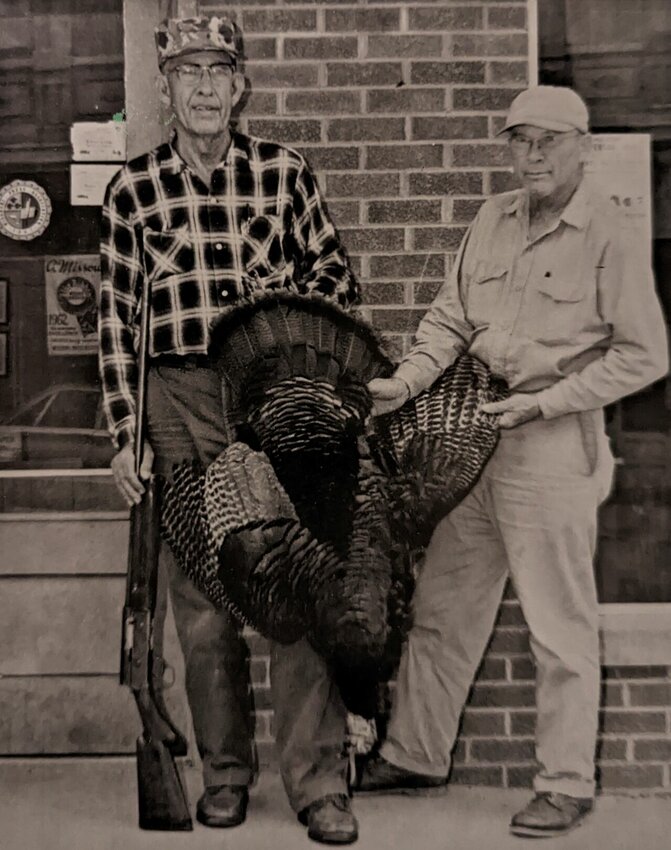 E.C. Nelson (right) helped Carl display a 20 pound gobbler bagged in April, 1967.