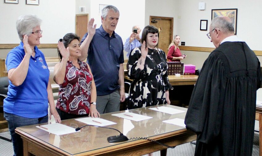 New 37th Judicial Circuit Court Appointed Special Advocate (CASA) volunteers were recently sworn by Presiding Judge Steven Privette, right, and promised to uphold their duties in helping neglected and abused children navigate the court system. CASA volunteers work with children that are often the subject of custody placements, and as their slogan says, &quot;in the best interest of the child,&quot; in order to find the best long-term solution in those cases. To learn how to be a CASA volunteer, call 417-255-2100, or send an email to casa.office@37thcasa.net. Taking their oaths, from left: Sherrie Robinson, Gina Osborn, Michael Ross and Kara Howe, all of West Plains.