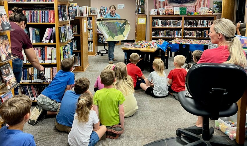 Sarah Elrod, conservation educator with the Missouri Department of Conservation, standing, visited Summersville Library on June 13 and brought an activity for Summer Reading Program participants, shared librarian Kathie Cox. Twenty-six children and 13 adults were in attendance.