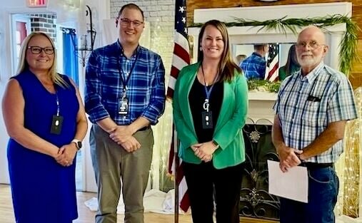 From left: West Plains Noon Rotary Club Secretary Missy McGoldrick, President-Elect Greg Carter and President Lana Snodgras with Sunrise Rotarian Jim Thompson, who swore them in.