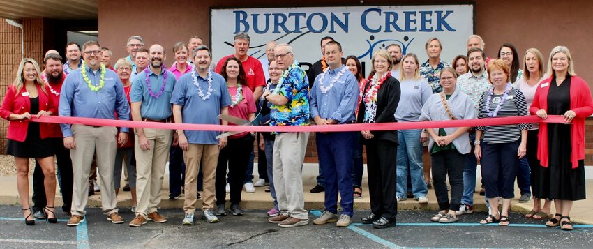 Burton Creek Rural Clinic recently celebrated the completion of renovations of waiting areas and the addition of offices and expanded lab space. All are under one roof at 805 N. Kentucky Ave. The clinic offers services including family practice, obstetrics, 3D and 4D ultrasounds, cosmetic procedures and mental healthcare. There are eight doctors on staff as well as two family nurse practitioners, a certified physician's assistant and two licensed clinical social workers who provide psychological therapy. The walk-in clinic is open from 7 a.m. to 6 p.m. Mondays through Fridays, 8 a.m. to 4 p.m. Saturdays, and 1 to 4 p.m. on Sundays, or call 417-256-2111 to make an appointment. Front row, from left: Greater West Plains Area Chamber of Commerce Ambassador Andrea Crews-Martin, Dr. Doug Crase, Dr. Aaron Mills, Burton Creek Rural Clinic Administrator Tyler Thompson, family nurse practitioners Hilda Newell and Lynn Crites, Dr. Robert Martin, Dr. Nate Swift, Dr. Leslie Barr, Melody Hubbell, and chamber ambassadors Judy Ingalsbe and Heather Foster.