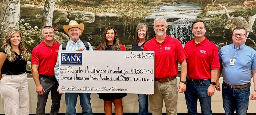 West Plains Bank and Trust Company is a sponsor of this year&rsquo;s Blue Jean Ball hosted by the Ozarks Healthcare Foundation. Pictured from left: Sammi Radosevich, Inside Track Career Pathways coordinator at Ozarks Healthcare; Nathan Cropper, West Plains Bank and Trust Company; Kenny Joplin, Ozarks Healthcare Foundation Board Chairman; Mindy Trail, Ann Marie Newberry, Eric Judd and David M. Gohn, all of West Plains Bank and Trust Company; and Josh Reeves, vice president of Development at Ozarks Healthcare.
