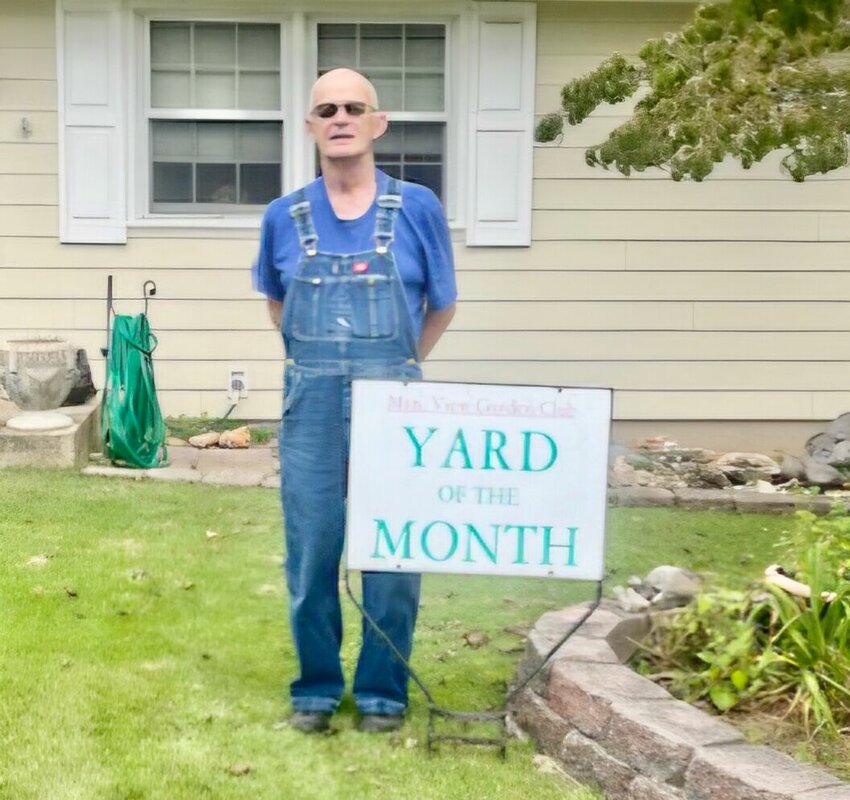 The Mtn. View Garden Club&rsquo;s September Yard of the Month was awarded to Tom Antrim, 314 Sharp St. &ldquo;The lawn in this yard is a lush carpet of zoysia grass,&rdquo; described club members. &ldquo;In the middle of the yard is a flowering dogwood tree that is planted in a raised bed with many perennial&nbsp;plants, and a concrete bench with an angel watching over everything in the yard. There are hydrangeas on the side of the house as well as rose bushes with a few blooms still hanging on. As you pass under the arbor into the back yard there is a pergola in the center of the yard. All of the paths are made of flat rocks or blocks. More hydrangeas are near the rear of the home, with woodsy herns and other plants.&rdquo; Antrim&rsquo;s late wife, Sandy, previously recognized several times with the award, was the gardener and keeper of the flowerbeds, but he crafted the structures and hardscape, club members added. &ldquo;Pride of ownership is evident throughout the property,&rdquo; they said. &ldquo;Mr. Antrim is a gifted woodworker. It was a pleasure to walk around his beautiful yard and see his wood projects and rock collection.&rdquo;