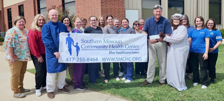 Southern Missouri Community Health Center contributed $1,000 toward the 37th Judicial CASA’s (Court-Appointed Special Advocates) annual dinner theater fundraiser, “How to Enchant a Bookshop,” held Sept. 7 at RubyDoo’s Vintage Events Center. CASA Executive Director Connie Pendergrass, center, said a full house attended and raised $21,500 to benefit the abused and neglected children CASA serves to advocate for. From left: Sherri Cromer, Dalene Nye, Travis Shearer, Ashley Grisham, Sierena Johnson, Missy Harmon, Brandy Barstow, Wilma Thompson, Taytum Dewitt,  Robien James, Megan Dobbs, Evanthia Hoffman, Tina Markel, Bryan Adcock, Pendergrass, Marlo Weeks, Ashley Olmsted and Courtnie Beals.