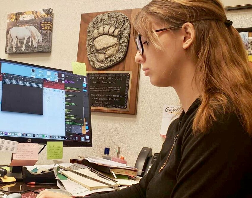 Mabel Schrippe, a 16-year-old junior at West Plains High School, job-shadowed Managing Editor Abby Hess, a family friend, Thursday at the West Plains Daily Quill. Schrippe was able to delve into Hess&rsquo; work life, and understand the inner workings at the Quill. She said she was immediately intrigued by the amount of organization between Hess and her coworkers. Schrippe decided to job-shadow an editor because formatting reports plays a key role in the career she intends to pursue. She plans to go to college for biochemistry and eventually become a forensic pathologist in a big city. While this dream is far from being accomplished, Schrippe, shown here writing her bio, said she is very excited for the opportunities being presented to her at the present time.