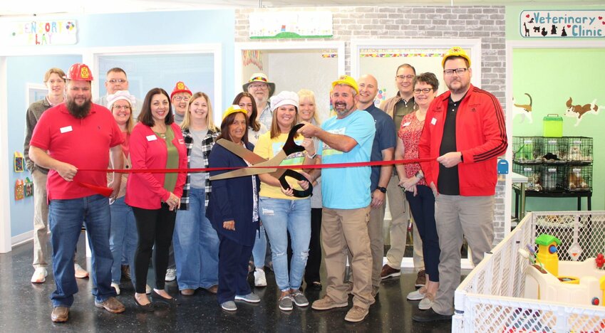 Teeny Tiny Town is now open at 919 Preacher Roe Blvd. in West Plains with nine themed play rooms and a party room available to rent. Themed rooms include a fire station and gas station, cafe, doll house, market, veterinarian clinic, construction and a classroom. The sensory-friendly room is equipped with toys that offer different textures and activities, and a &quot;decompression&quot; room is designed for when children need a break from the excitement. Rates are for two-hour play sessions and hours are from 10 a.m. to 6 p.m. Sundays, Tuesdays, Wednesdays and Thursdays, and 10 a.m. to 7 p.m. Fridays and Saturdays. Teeny Tiny Town is closed on Mondays. Call 417-257-9811 or visit the website at teenytinytownllc.com for details about rates and party rentals and to see a photo gallery of play areas. Front row, from left: Greater West Plains Area Chamber of Commerce Ambassadors Justin Jones and Cynthia Haigler, Reta Cooper, Teeny Tiny Town co-owners Amanda Koon and Maurice Koon and chamber ambassador Jeromy Beasley.