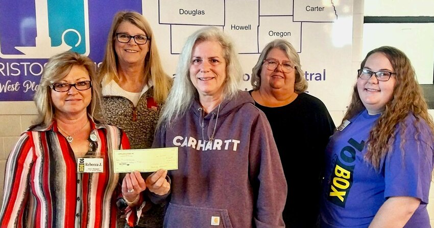 Early in December, 10Box in West Plains donated $1,000 to Christos House domestic violence and sexual assault resource provider. 10Box employee Sarah Bullock nominated Christos House for the donation. &quot;They helped my sister-in-law in the past when she was in need,&quot; said Bullock. From left: 10Box Store Manager Rebecca Johnson; Christos House outreach advocate Kenya Cook, Executive&nbsp;Director Kelli Neel and outreach advocate Brenda Lewis; and Bullock.