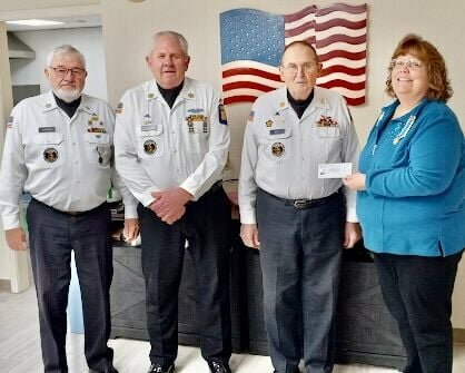Members of the Ozark Spring chapter of the National Society Daughters of the American Revolution, on the recommendation of Chapter Regent Rebecca McKinney, recently collected and donated $400 to support the West Plains-based Honor Guard as a chapter regent&rsquo;s project. McKinney presented the check to Honor Guard members at the chapter&rsquo;s monthly meeting on Jan. 4. Ozark Spring has long been a supporter of the Honor Guard, providing financial support when a new van was purchased in the late 2000, updating uniforms and purchasing rain gear, plus providing funds for gas and meals when Honor Guard members support local military funerals and ceremonies. DAR chapter members added they are proud of the service relationship that have with the Honor Guard and enjoys providing support when they can. From left: Honor Guardsmen Perry Johnson, Jerry Lair and Commander Larry Ball, and McKinney.