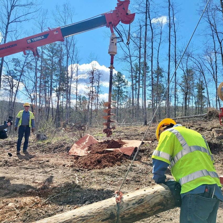 Howell-Oregon Electric Cooperative&rsquo;s Shannon County crew work to install a new line for new home construction. Sometimes, co-op officials explained, if existing lines are close, the construction is a smaller project, but other times, if the lines are further from the new build site, additional lines and poles must be installed to reach the location. Before construction can actually begin on the lines, all membership applications and right-of-way easements must be obtained and verified. Prospective homebuilders are encouraged to contact the cooperative sooner rather than later to make sure their timelines and the cooperative&rsquo;s will work together.
