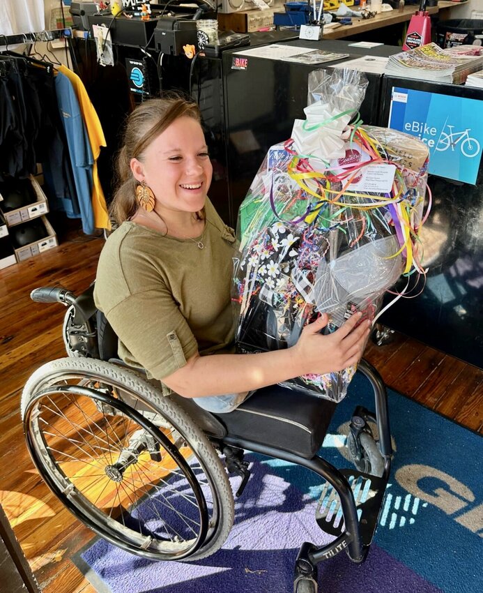 Ania Bradley of West Plains is the winner of this month’s West Plains Downtown Passport prize basket, presented to her on Wednesday morning at the West Plains Bike Shop. The basket is valued at $350 and includes gift certificates and items from downtown retailers West Plains Farmers and Artisans Market; Right Off the Bat; Country at Heart; Life Phases; Büro Office Supply; Alan’s Muscle Mart, Mommas, Babies and Blessings; 10/40 Coffee, West Plains Music; Johnny Hatchets Axe Throwing and Coffee House; KC’s Sports Bistro; Black Lagoon; Bring Your Own Dog Dog Wash; The Book Nook; Davis and Sons; Dev’s Steakhouse and Piano Bar Lounge; The Frame Shop; KMC Creations; Lux Med Spa; Ozark Pizza Company; Perry’s Barber Shop; Revelry Ink; Rickie David Jewelers; West Plains Bike Shop; West Plains Daily Quill; and Wildflower Hair.