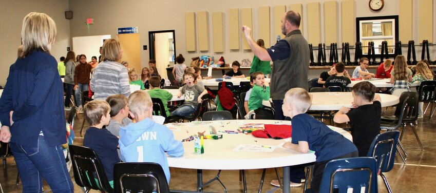 South Fork Principal Seth Huddleston made final announcements for the day to students that attended classes Monday in the fellowship hall of First Baptist Church on Walnut Street in West Plains. Classes had been moved because power was out at the school. South Fork is a kindergarten through eighth grade school located about 10 miles southwest of West Plains, and is part of the West Plains R-7 School District. Students were given the option to be bused to West Plains from South Fork, and about 150 out of 190 students did so, Huddleston said. The effort was made to return children to a sense of normalcy after some families were affected by the storm and heavy damage to the area near the school. Students ate lunch at the West Plains Middle School and returned to the church for ice cream provided by Mission First Medical, owned by Huddleston&rsquo;s wife Suzanne, and Spring Dipper of West Plains. By Tuesday morning power had been restored to the school and classes resumed as normal, with thanks given by district officials to Howell-Oregon Electric Cooperative and the First Baptist Church.