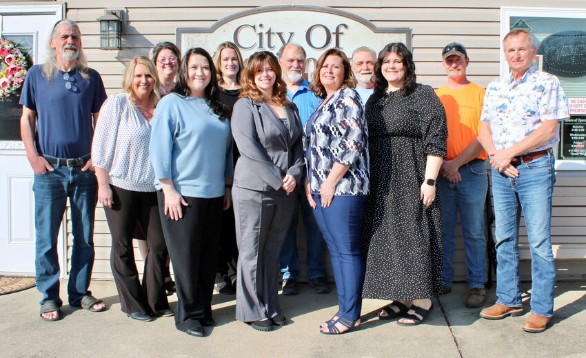 Bids are likely to go out this fall for street work in Koshkonong, the recipient of a $408,067 grant for street improvement given by the Missouri Department of Economic Development and administered through the South Central Ozark Council of Governments. The funds will be used to improve Jewell and Grand streets, making them more navigable and safer for students riding the bus to and from school. Front row, from left: SCOCOG Grants Manager Melanie Barnett, Planner Jenni Collins and Community Development Specialist Jessica Green; Koshkonong Mayor Jennifer Johnson and City Clerk Hope Reed; and Smith &amp;amp; Co. Engineers Client Liaison and Special Projects Engineer Kurt DiCiro. Back row: Koshkonong Alderman Mark Sanders, SCOCOG Senior Compliance Specialist Jess Moran and Communications and Marketing Coordinator Angie Ball, and Koshkonong aldermen Michael Goss and George Hunt, and Water and Sewer Supervisor Nick Reed.