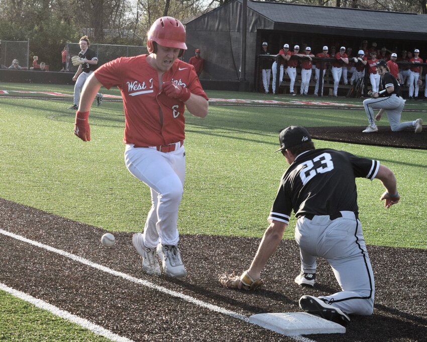 Camden Bryant reaches base as the ball gets missed by the Willard first baseman Wednesday, during the Zizzers' 8-1 loss to the Tigers on the field at Zizzer Ballpark. The West Plains junior varsity team also fell to the Tigers 12-0.