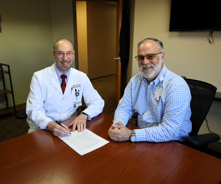 Dr. Hollis Tidmore, left, vascular surgeon, recently signed a two-year contract extension at Texas County Memorial Hospital in Houston. With him is TCMH CEO Bill Bridges.