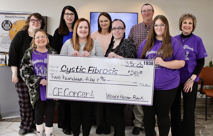 Wood &amp; Huston Bank of West Plains was a $250 contributor to local fundraising efforts to find a cure and treatments for cystic fibrosis. The donation was made in support of the 37th annual Cystic Fibrosis Concert that ultimately raised $79,000. Front row, from left: Cystic Fibrosis of West Plains volunteer Jessica Joice-Frazier, Wood &amp; Huston Bank employees Ashley Young and Ashlynn Waggoner, and Cystic Fibrosis volunteer Katlyn Johnson. Back row: Wood &amp; Huston Bank employees Zoe Mahoney, Karen Eggert, Belinda Kuntz and Kent Kelley, and Cystic Fibrosis volunteer Lois Frazier.