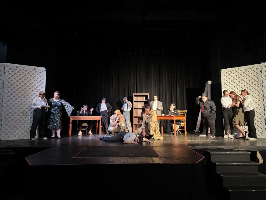 Detectives investigate a murdered corpse as loved ones, legal professionals, and suspects look on in &ldquo;Love, Law, &amp; Murder,&rdquo; penned and directed by local playwright Annabelle Buhler. The noir-inspired murder mystery is centered around the death of a mob boss&rsquo; son.