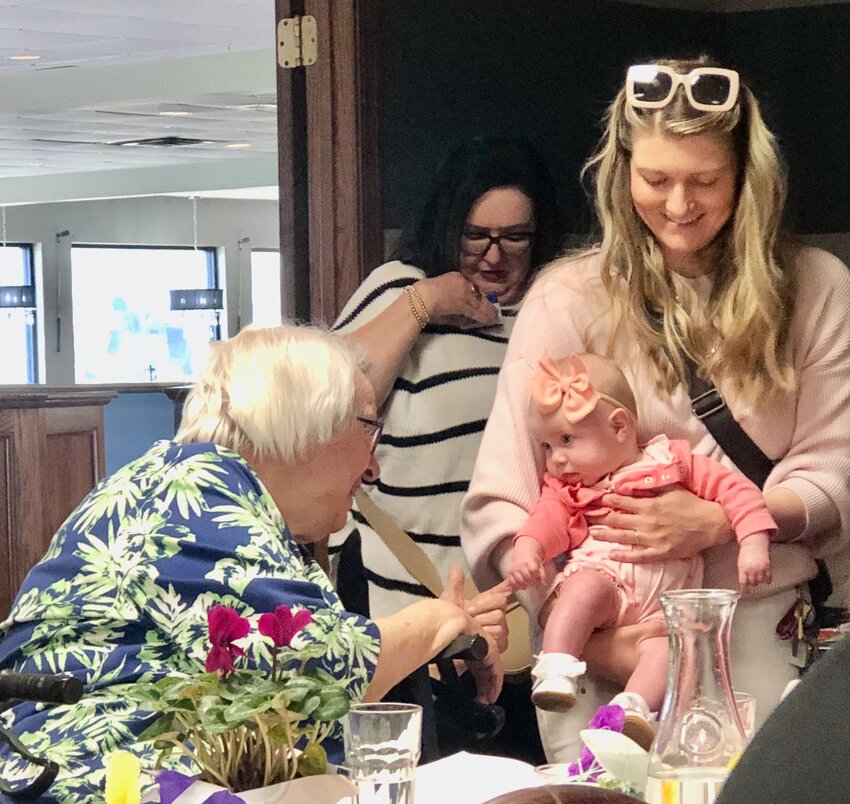 Delta Kappa Gamma, Xi Chapter member Katie Cahoj, standing, right, attended the organization’s latest meeting in West Plains with her daughter Lilly in tow, a first for the chapter.