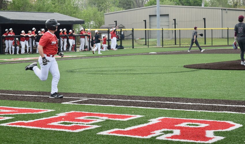 Zizzers senior Avery Miller looks to his left to watch his first career home run, a grand slam, cruise over the left field fence Thursday at Zizzer Ballpark, as West Plains defeated Logan-Rogersville 9-4 in an Ozark Mountain Conference game