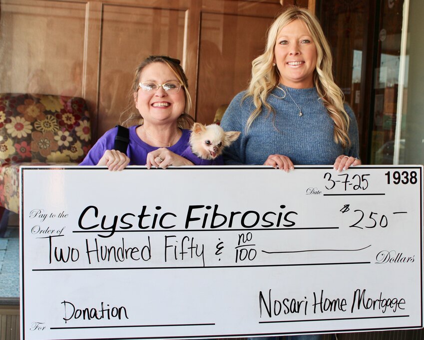Nosari Home Mortgage, represented by loan officer Kimberly Bontrager, right, was a $250 sponsor of the annual Cystic Fibrosis of West Plains fundraising concert, helping make the event a success with about $79,000 total raised. It was the 37th year for the event, the signature fundraiser for the local group that works for months each year to bring nationally known country music acts to West Plains, including this year's performer Rodney Atkins. Accepting the contribution is Cystic Fibrosis of West Plains volunteer Jessica Joice-Frazier, holding her dog Olive.
