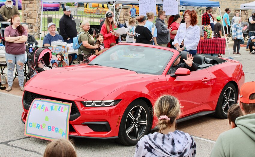 Stasia Kelly, daughter of Emmett Kelly, Sr., is seated in the backseat of a convertible, featured in a parade held during the Emmett Kelly Clown Festival, held last weekend in Houston. Emmett Kelly was born in Kansas and spent his childhood in the Cabool and Houston area as part of a farm family, according to the Missouri State Historical Society of Missouri. He moved to Kansas City to look for work at about age 19 and eventually found work in carnivals and the circus. Stasia Kelly was born to Emmett and his second wife Elvira after he had been a performer for Ringling Brothers and Barnum and Bailey Circus for over 13 years, according to SHSMO.