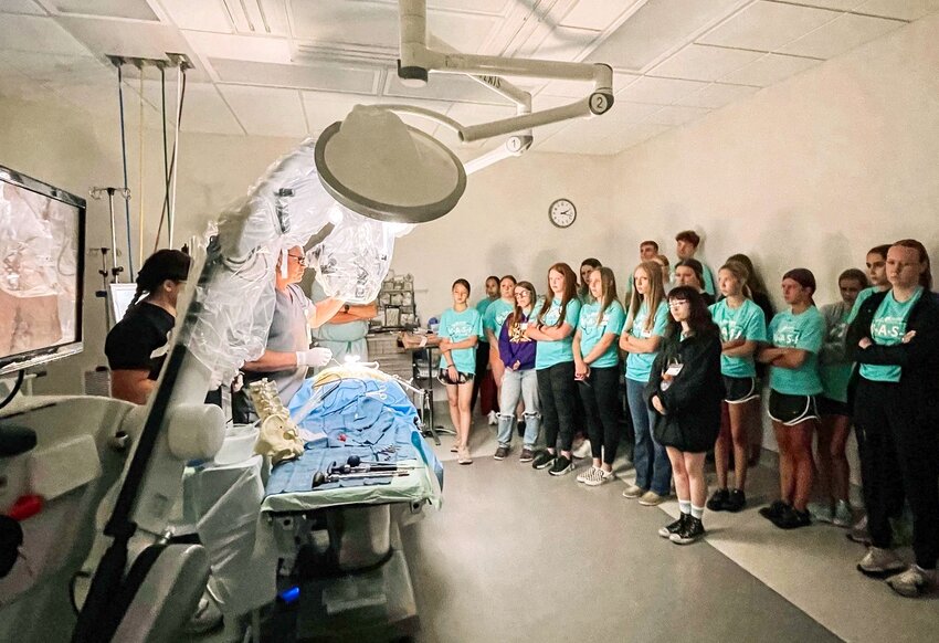 M*A*S*H Camp students from last summer observed a spinal anatomy demonstration led by Dr. Troy Caron of Ozarks Healthcare Orthopedics and Spine in a simulated operating room setting.