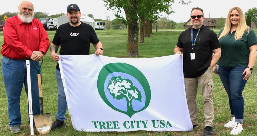 The City of West Plains has planted trees at the North Terra Golf Club in honor of Arbor Day, and as a participant in the Tree City USA program, the 14th year the city has taken part. City Clerk Kellie Mayers, right, said the city looks forward to continuing the effort to plant trees on public property, the goal being environmental stewardship. With Mayers, from left, are West Plains Mayor Mike Topliff, Public Relations Coordinator Cody Sanders and Community Services Director Todd Shanks.