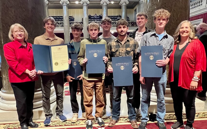 The West Plains Zizzer Cross Country team Tuesday traveled to the Missouri State Capitol in Jefferson City for winning the 2024 Class 4, District 2 Cross Country State Championship. Missouri 33rd District Sen. Brad Hudson and 154th District Rep.  Lisa Durnell and their staff introduced the team on both the House and Senate floors. From left: Durnell, team members Kyler Gunter, Trevin Smith, Hunter Stanley, Carson King, Hoyt Stiner, Blake Romans, Joseph Roberson and Zizzer Cross County Head Coach Alicia Gunter.