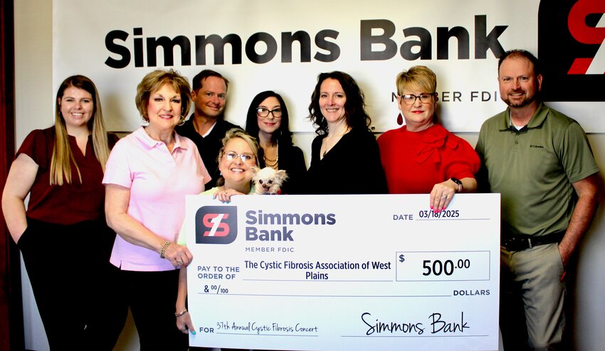 Simmons Bank made a $500 contribution towards the recent Cystic Fibrosis of West Plains fundraising drive. The donation was part of an annual effort by local volunteers around the Cystic Fibrosis Benefit Concert held in March, when local businesses and individuals rally to raise money for research into cystic fibrosis treatments and cures. From left: Simmons Bank employee Bailey Crank, Cystic Fibrosis volunteer Lois Frazier, Simmons Bank employee Kevin Trimble, Cystic Fibrosis volunteer Jessica Joice-Frazier and Simmons Bank employees Paige Mercado, Kelley Phillips, Bethany Dasko and Jon Plummer.