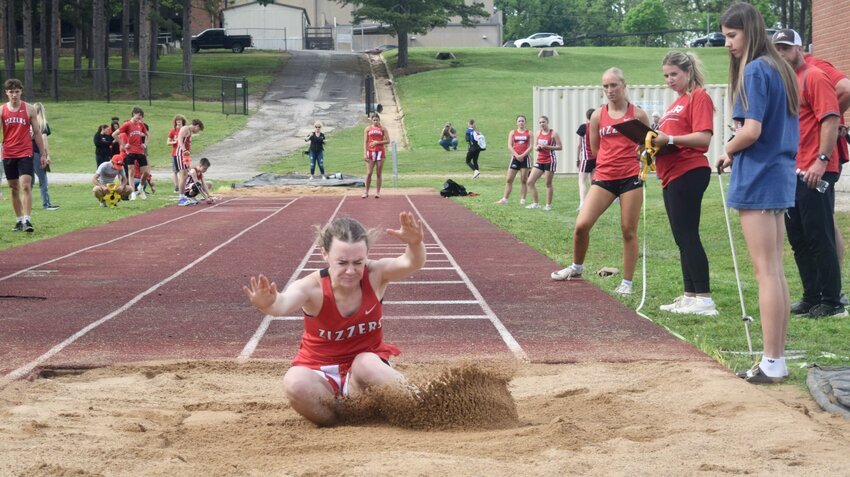 West Plains High School junior Lily Dixon of the Zizzers girls track and field team, lands a long jump Monday during the Last Chance meet at Zizzer Stadium. &quot;Monday&rsquo;s Zizzer Last Chance meet was a late season tune-up meet designed to allow athletes a last chance to get season best performances for district seeding at the district meet,&quot; West Plains Head Coach Greg Dixon said. &quot;It is also a meet to give schools a chance to get additional entries in specific events, if they meet MSHSAA (Missouri State High School Athletics Association) state standards in that event.&quot; Along with West Plains, teams from Marshfield, Nixa and Mtn. Home (Ark.) Christian Academy participated in the meet. &quot;We were able to get the entire meet in even though we had rain,&quot; Dixon said. With seedings and the bracket not yet finalized, the Zizzers boys and girls teams are set to compete today in the district championship meet at Carl Junction.