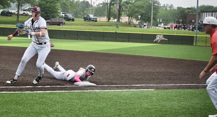 Avoiding a pickoff, Zizzer baseball senior Hunter Roberts slides back to first base, as the ball goes past Strafford junior first baseman Colron Dampier, Thursday at Zizzer Ballpark. West Plains defeated the Indians 4-3 in the bottom of the seventh inning. The Zizzers are set to begin Class 5, District 6 competition as the fourth seed, starting with fifth-seed Bolivar, 1:30 p.m. Wednesday at Central Baseball Field in Springfield.