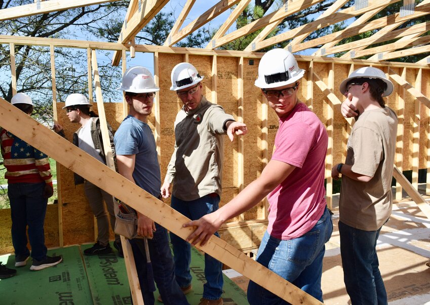 Southern Missouri Technical Institute carpentry instructor Chris Reese provides direction to carpentry students, from left, Carson Johnson of Summersville, Tucker Thomas of Mtn. View and Blaydon Wilkins of Birch Tree. The students have been building a new press box, concessions stand and restrooms at Zizzer Ballpark. Reese said the work began this school year and should be completed by February.