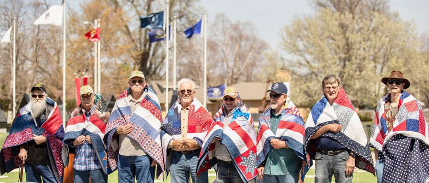 Stan Davis of West Plains, second from left, was one of eight veterans to receive a quilt during a recent Quilts of Valor ceremony recognizing Vietnam veterans. With him, from left, are fellow honorees Martin Jones, Tom Shields, Oscar Bronson III, Jesse Irwin, Chris Elswick, Gordie Godfrey and Dr. C. Tucker Joustra.