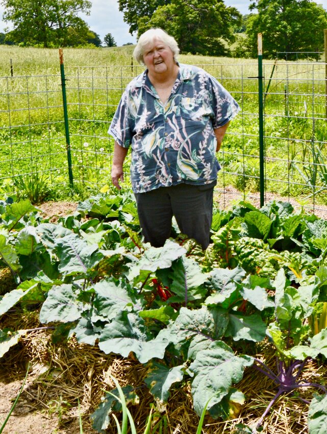 In this Quill file photo snapped in June 2015, Meredith Sisco shows her garden&rsquo;s bounty. Gardening, along with storytelling through prose and music, are among the passions she&rsquo;s most well-known and admired by many for. Sisco was recently awarded a Missouri Living Traditions Fellowship by the Missouri Folk Arts Program.