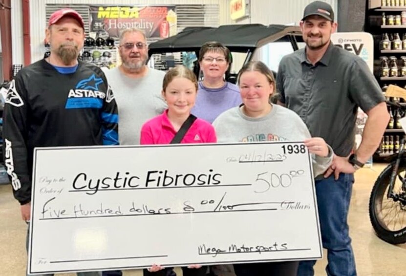 Mega Motorsports of West Plains was a $500 donor to the 40th annual Cystic Fibrosis Buddy Bass Tournament, held April 12 at Lake Norfork Marina at Henderson, Ark., and organized by Cystic Fibrosis West Plains. From left: Tim Lockett, Derrick Burtchett, Olivia Eggert, Kim Burtchett, Shelbi Eggert and Travis Olmstead.