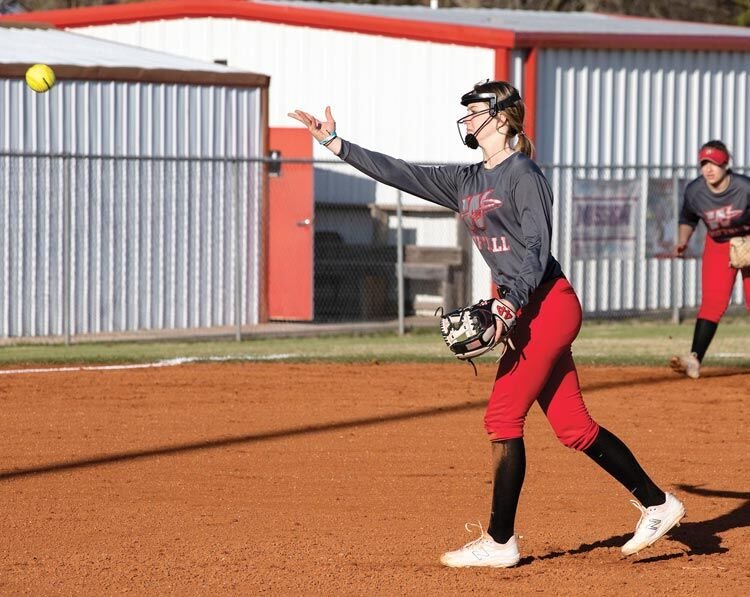 Washington sophomore Tinley Lucas lets a pitch fly for the Warriors. Lucas and company play host beginning today (Thursday) at the Washington Invitational Softball Tournament.