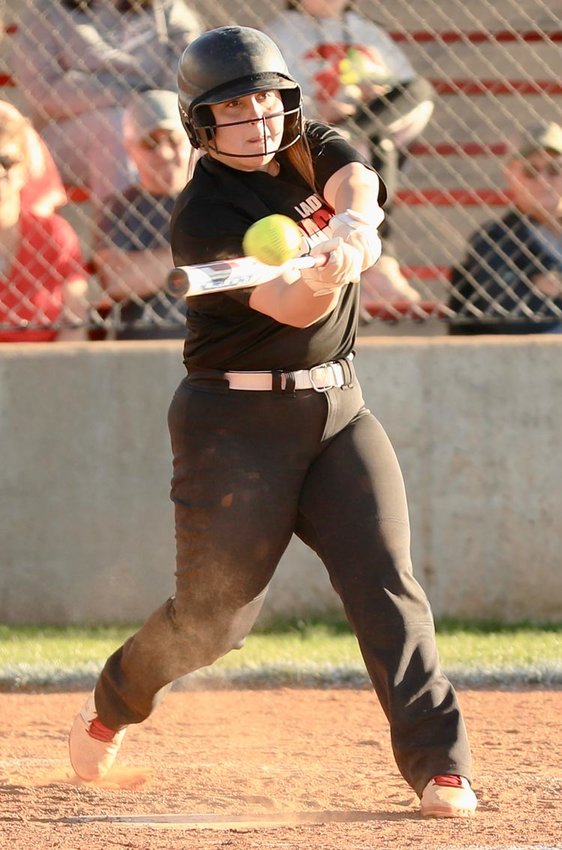 Purcell senior Hannah Buchanan hits a triple Monday evening against AmPo. Buchanan went 2-2 and scored Purcell&rsquo;s only run in the 15-1 loss.