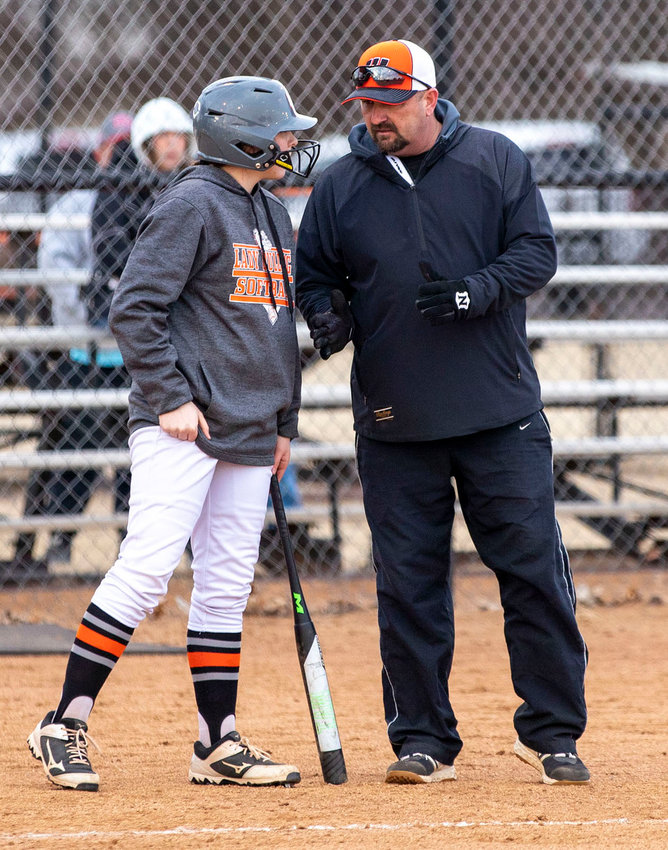 Kaylee Madden gets some one-on-one coaching from Charles Durrence during Wayne&rsquo;s 9-1 win over Ninnekah. Madden and the Lady Bulldogs will be in Purcell to take on the Dragons Monday March 21.