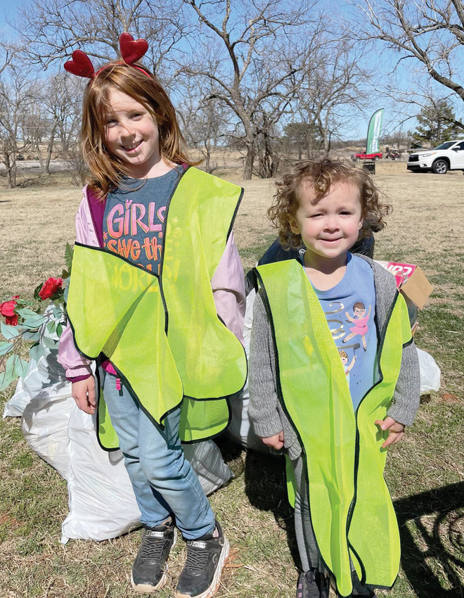 Children are never too young to learn about caring for the environment. These two girls were among volunteers picking up trash Saturday around Purcell Lake during the 2022 Great American Cleanup - Oklahoma!