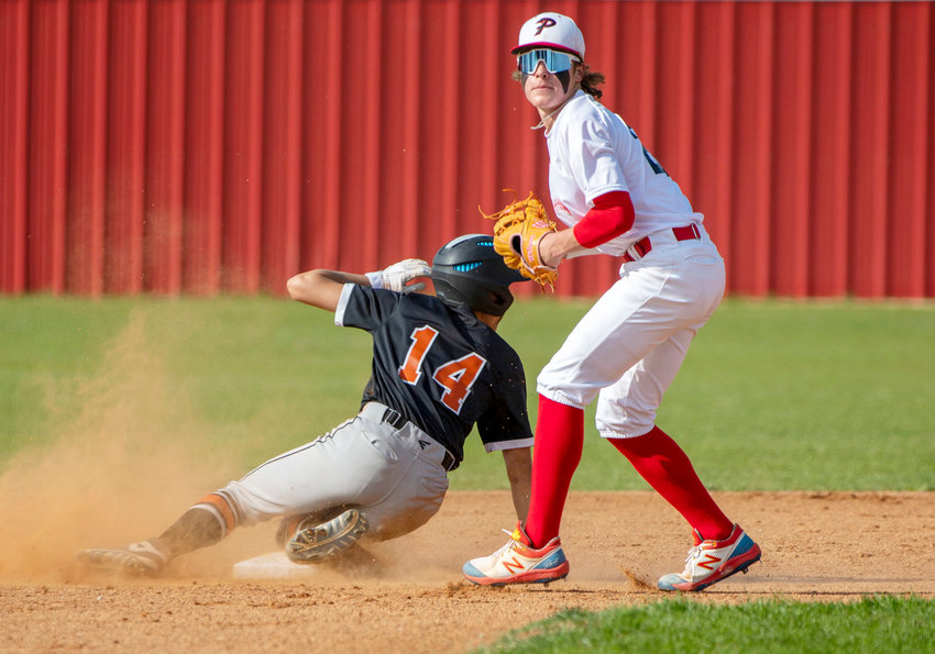 Purcell freshman Boston Knowles looks to the next play after tagging out a Lexington baserunner at second base. The Dragons defeated the Bulldogs 12-2.