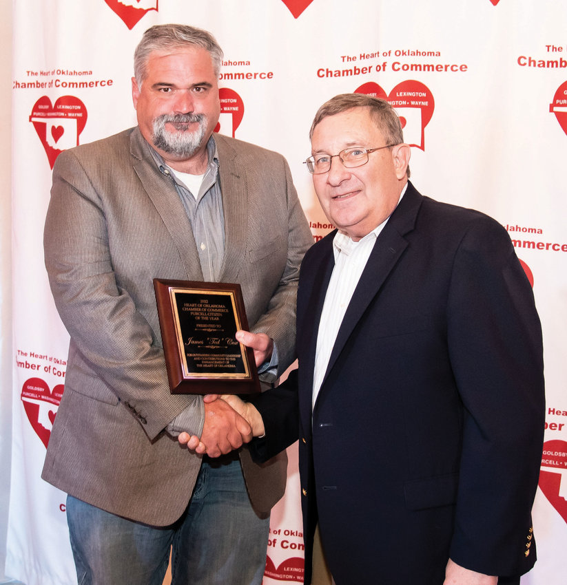Purcell Accountant and Mayor Ted Cox was presented with the Purcell Citizen of the Year plaque by Purcell Register Publisher John D. Montgomery at the chamber banquet last Thursday night.