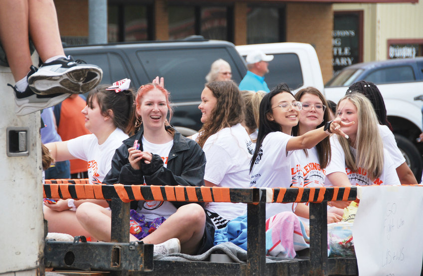 Lexington students let the candy fly out of their float entry in the annual 89er&rsquo;s Day Parade.