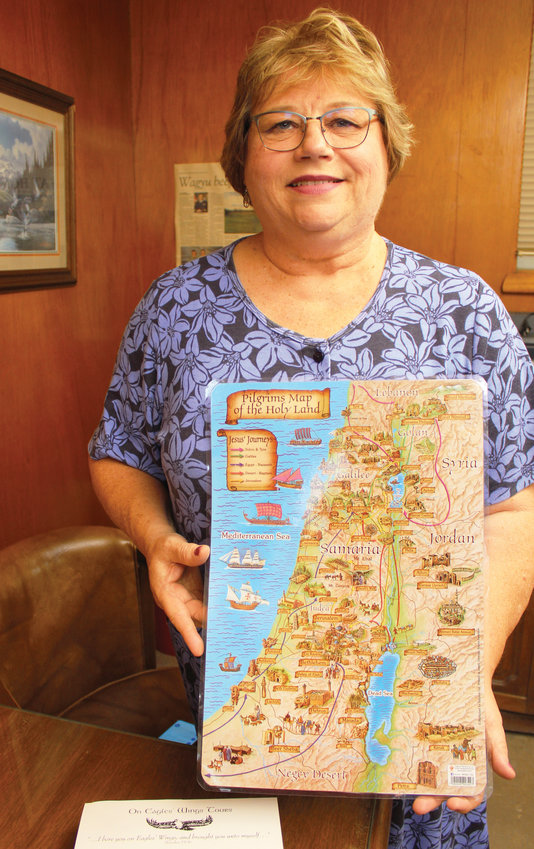 Elaine Howsley holds a map of ancient Israel. The pastor at First Christian Church, Disciples of Christ, is back from a 2-week tour that traced Jesus&rsquo; ministry.