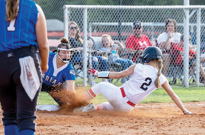 Purcell sophomore Hadleigh Harp slides into third base against Little Axe during the Dragons&rsquo; 9-3 win Monday.