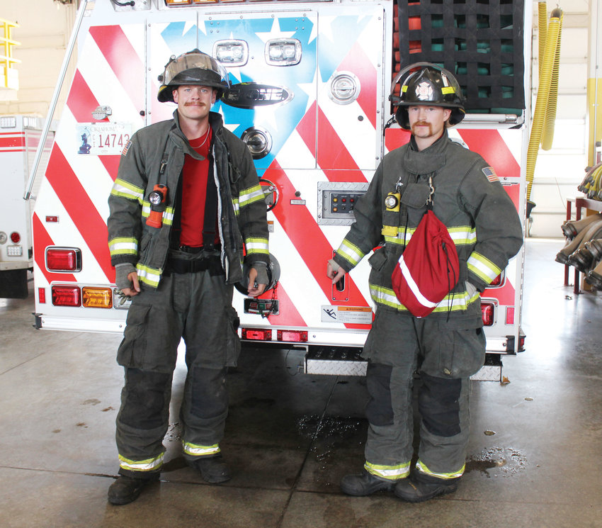 Cpl. Tanner Bell, left, and firefighter/driver James Albertson model the protective bunker gear they don for every call. Some sources cite cancer rates among firefighters and maintain the gear is manufactured using a purported carcinogen.