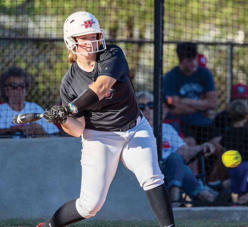 Washington senior Maggie Place picks out a pitch during the Warriors&rsquo; 7-1 win over Yukon on Monday. Place had one RBI in the game.