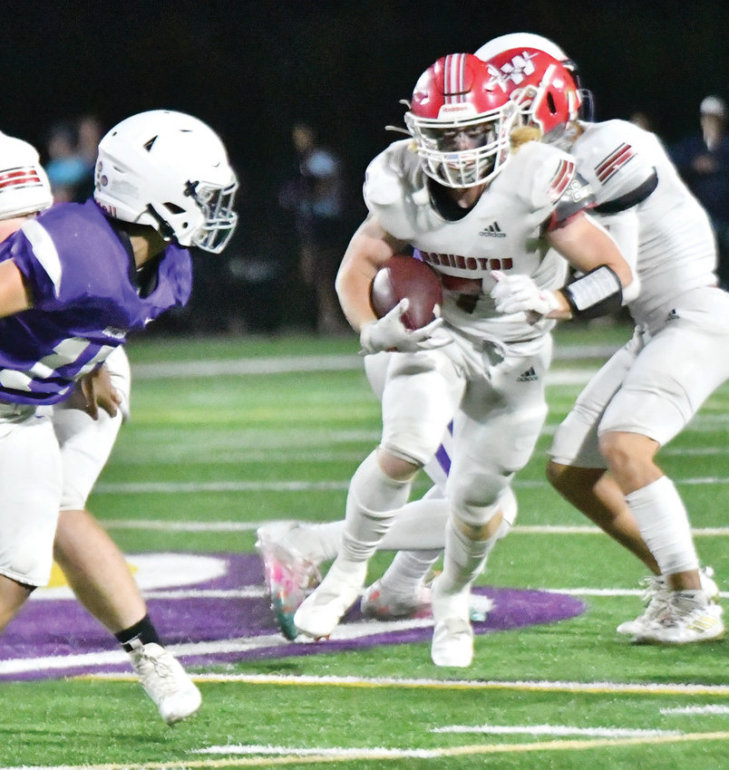 Washington senior Cole Scott runs through a wide-open hole during the Warriors&rsquo; 42-7 win over CCS. Scott rushed the pigskin 16 times for 93 yards and a 10-yard touchdown in the game.