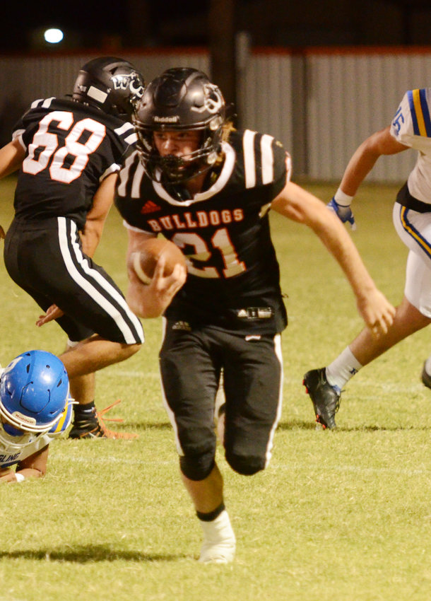 Wayne junior Eli Hobson runs up the field with the ball. Hobson and the Bulldogs host Wynnewood tonight (Thursday) at 7 p.m.