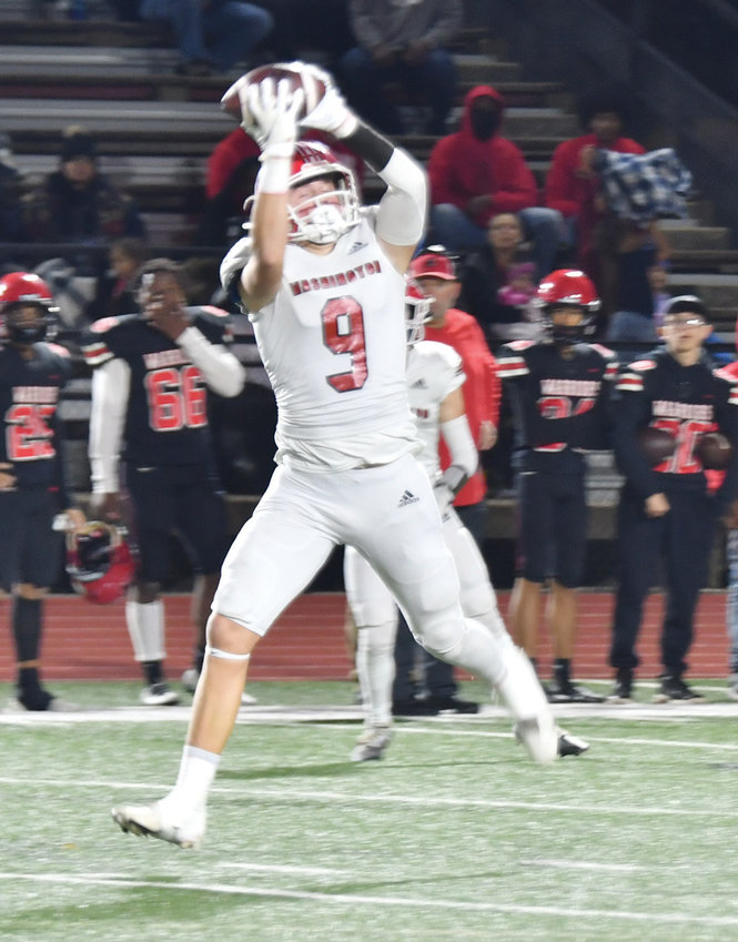 Washington sophomore Nate Roberts works over the middle last Friday during the Warriors&rsquo; 47-6 win over Idabel. Roberts caught a 79-yard touchdown pass from Major Cantrell in the game. Washington will play Jones in the semifinals Friday at Putnam City at 7 p.m.