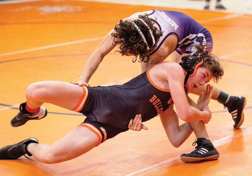 Lexington wrestler Jesse Stockdale works on his opponent during a recent match.